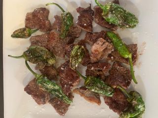 Piece of sirloin Steak with Green padrón peppers